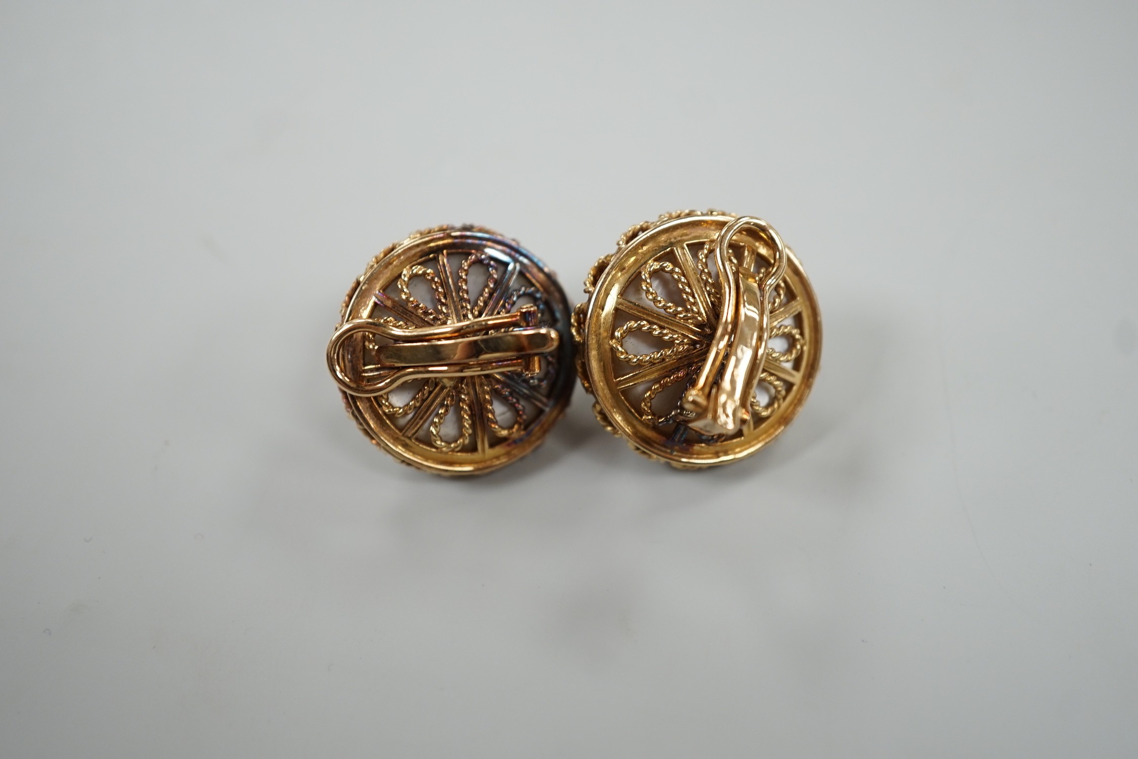 A pair of modern continental yellow metal and mabe pearl set ear clips, diameter 22mm, gross weight 18.2 grams.